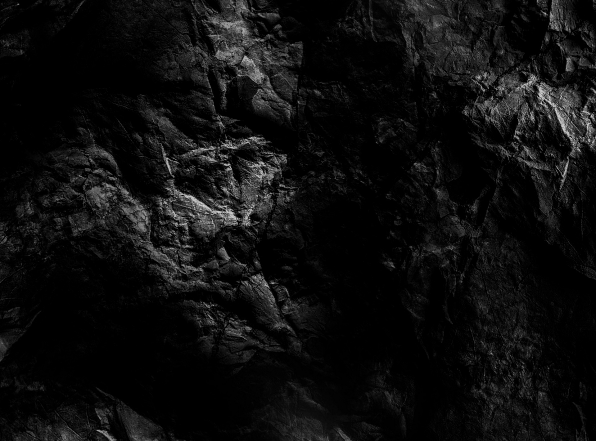 black stone background. black and white grunge background. old black stone wall. grunge banner. dark gray stone background. geometric stone pattern.